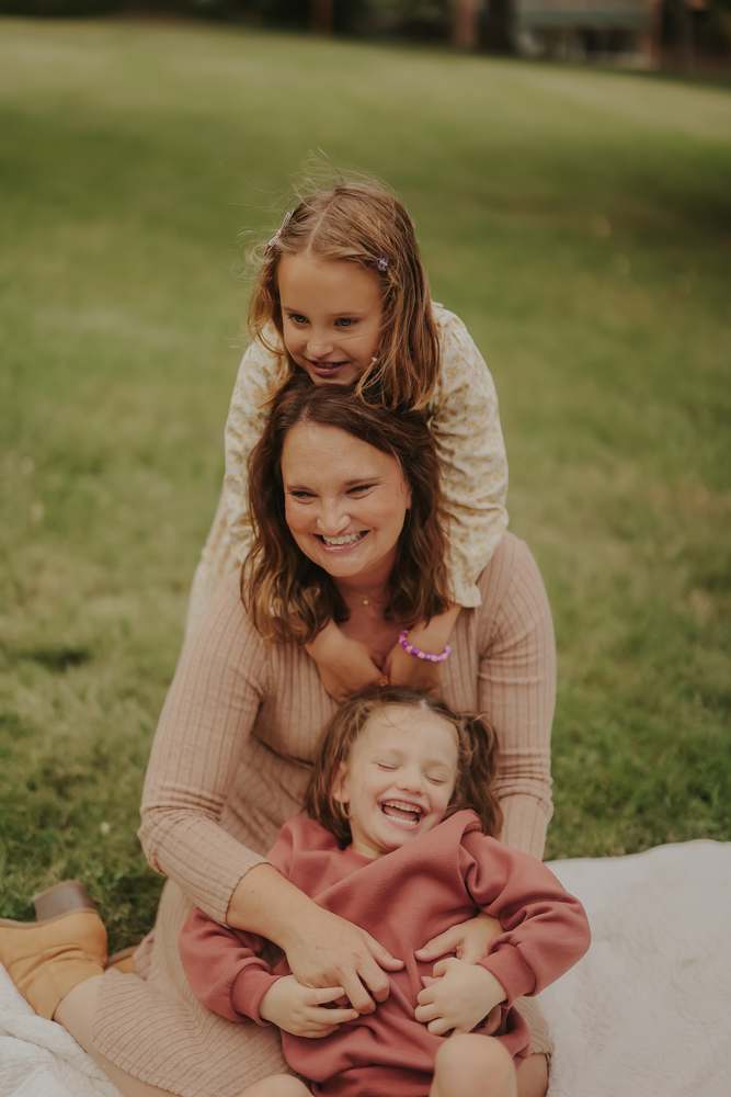Daughters wrapped around their mother