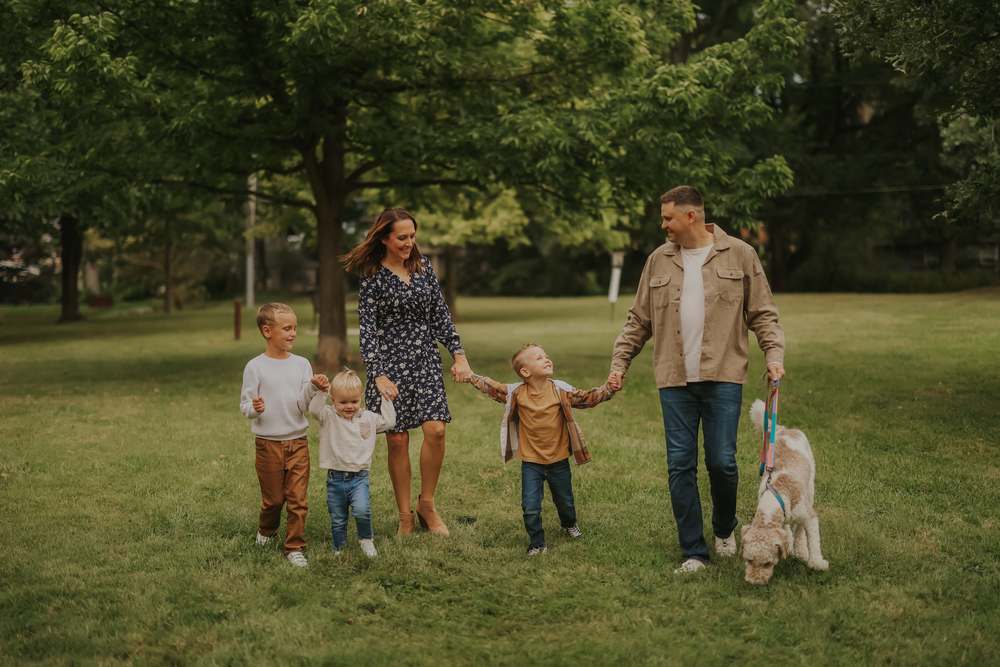 The family walking together with the dog