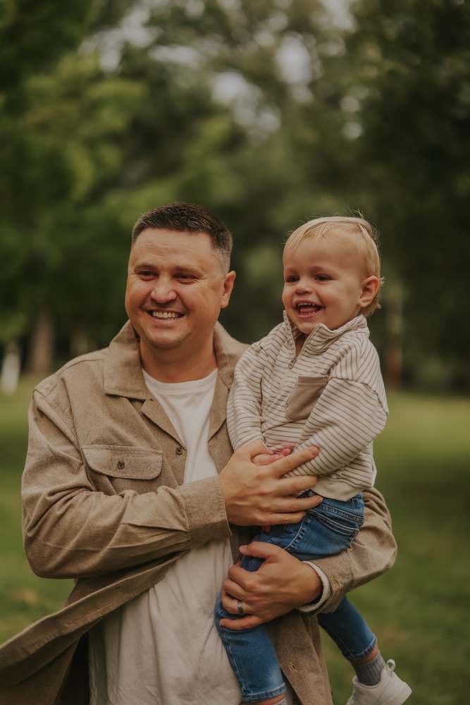 A father carrying his youngest