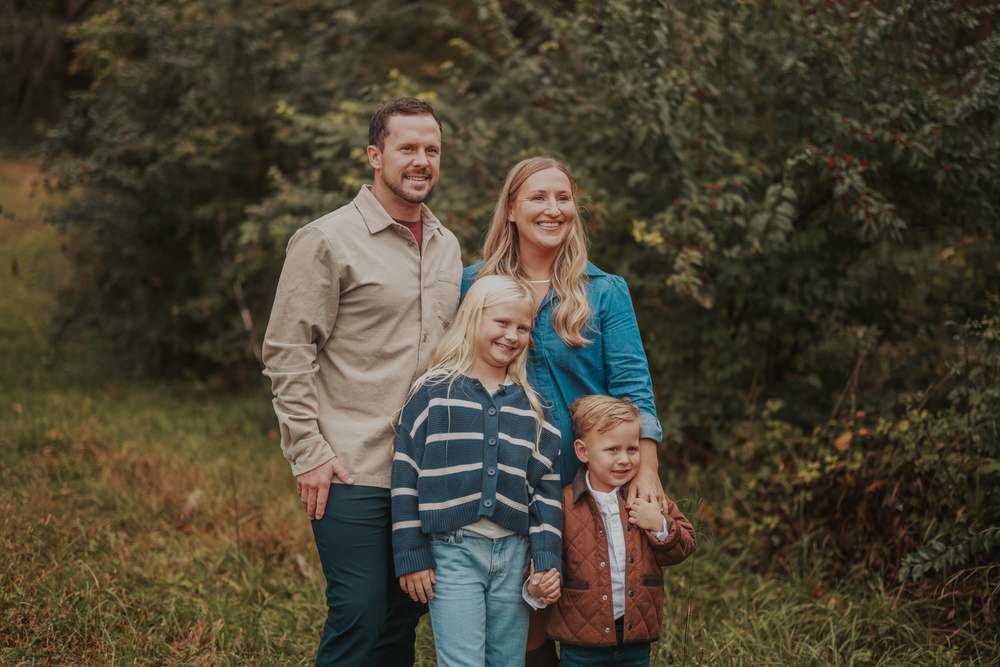 A family of four in the Fall field