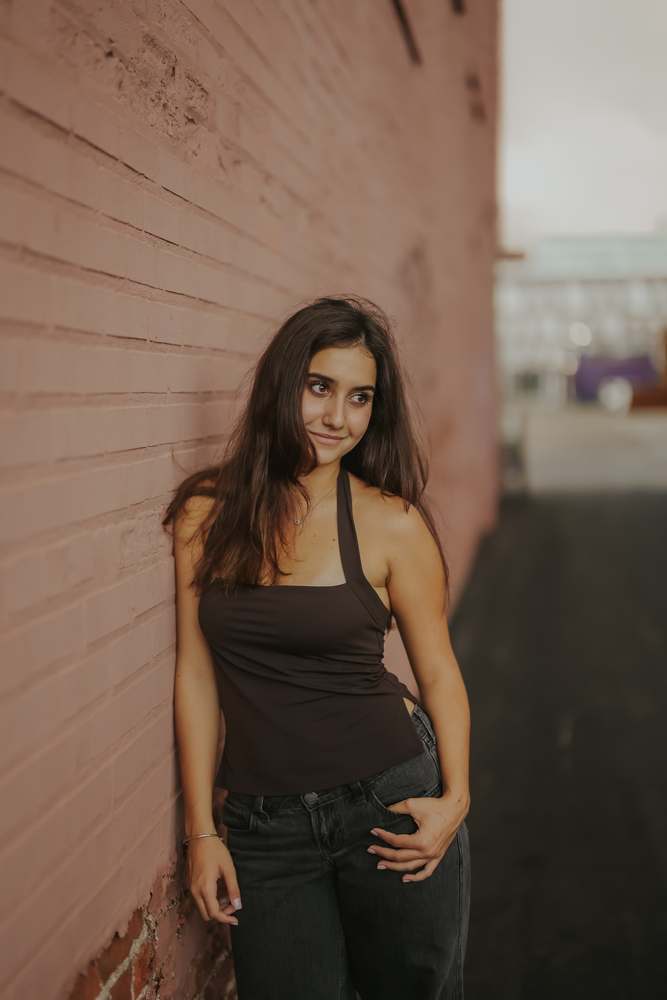 Portrait against the painted brick