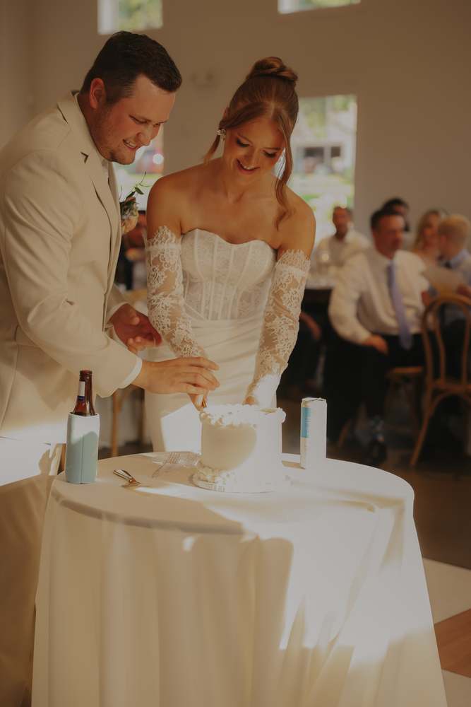 Cutting the cake in front of their guests