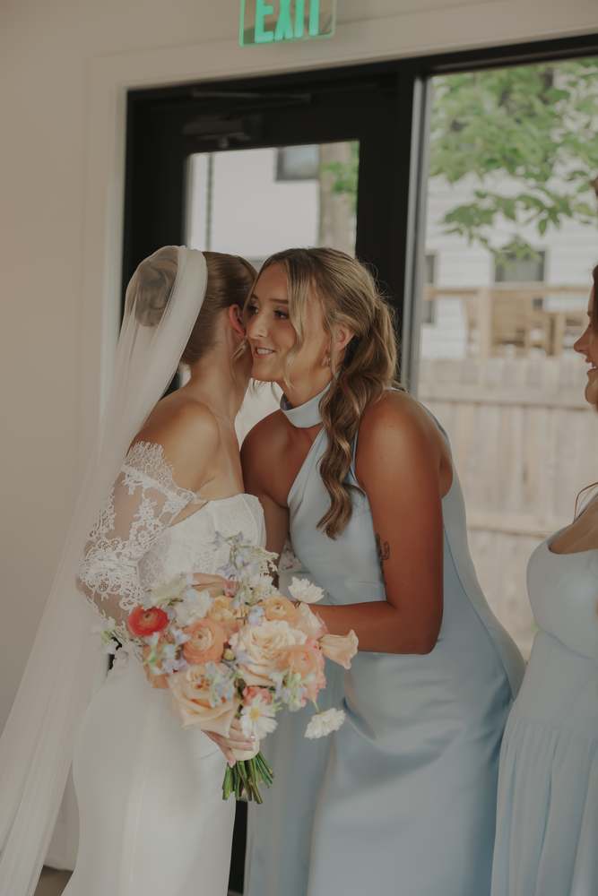 Bridesmaids in powder blue before the ceremony