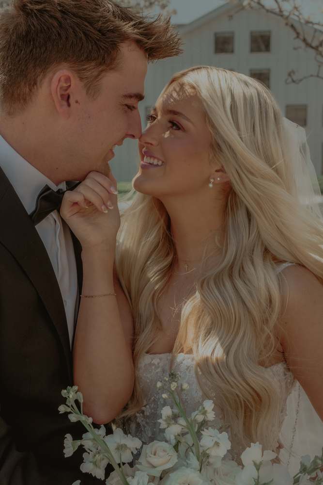 Close portrait of the couple, foreheads touching