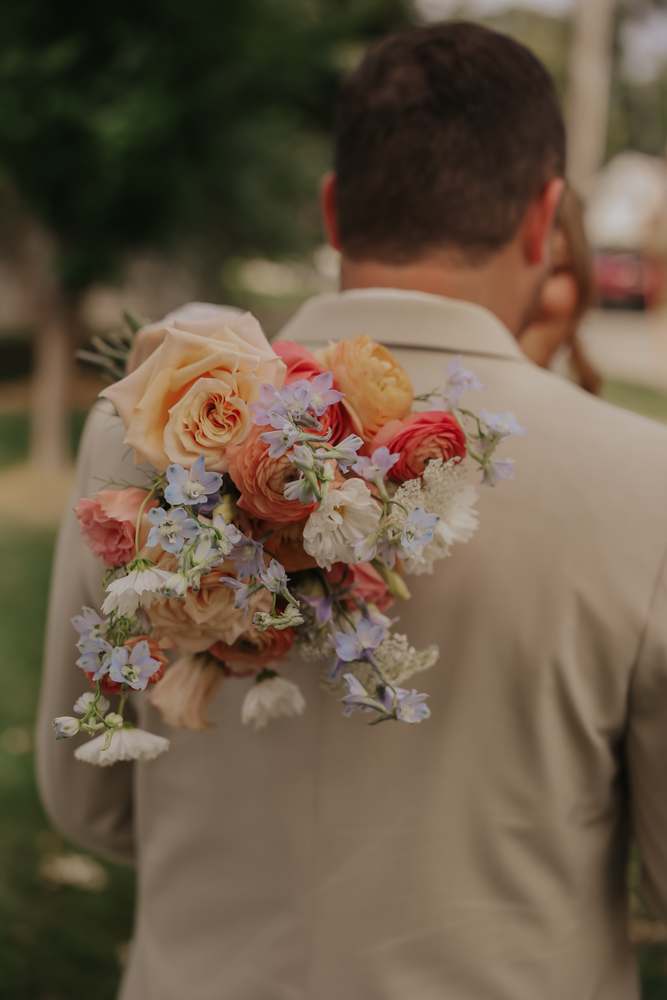The bouquet held between them