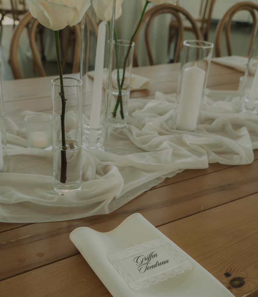Reception place setting under taper candles