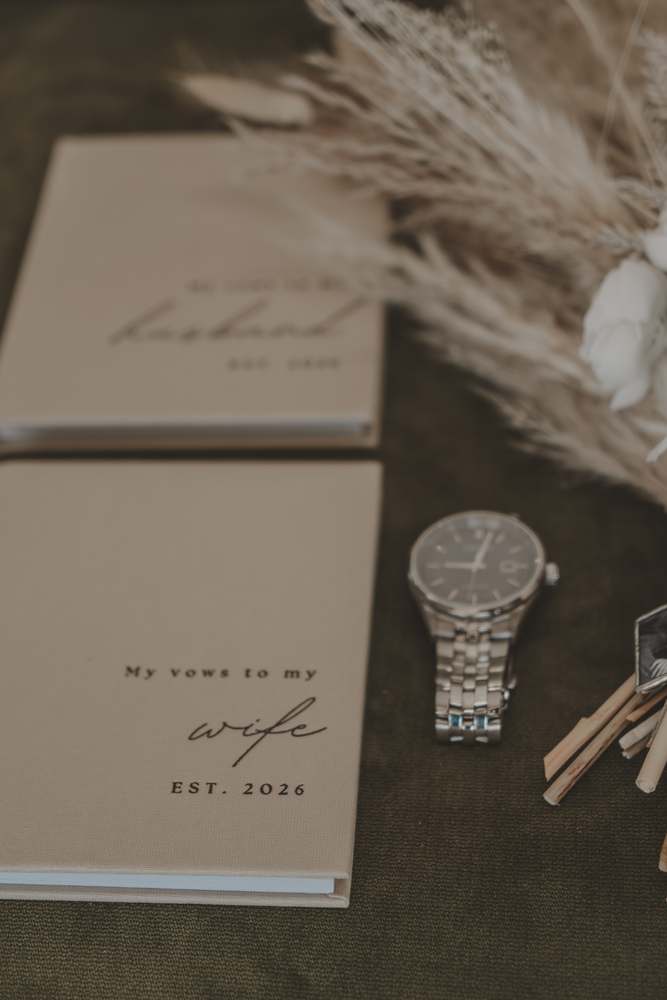 Vow books, watch and boutonniere before the day begins