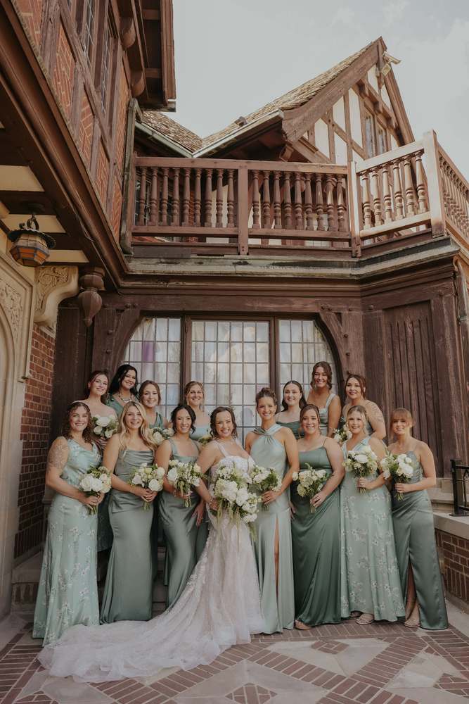 Bridesmaids in sage on the terrace steps